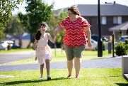 Girl and her Support Worker walking together