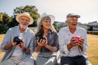 3 older friends playing boules