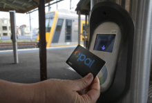 Person tapping his opal card