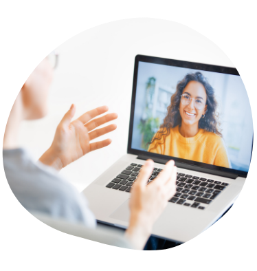 Image of woman smiling on a laptop screen during a video call