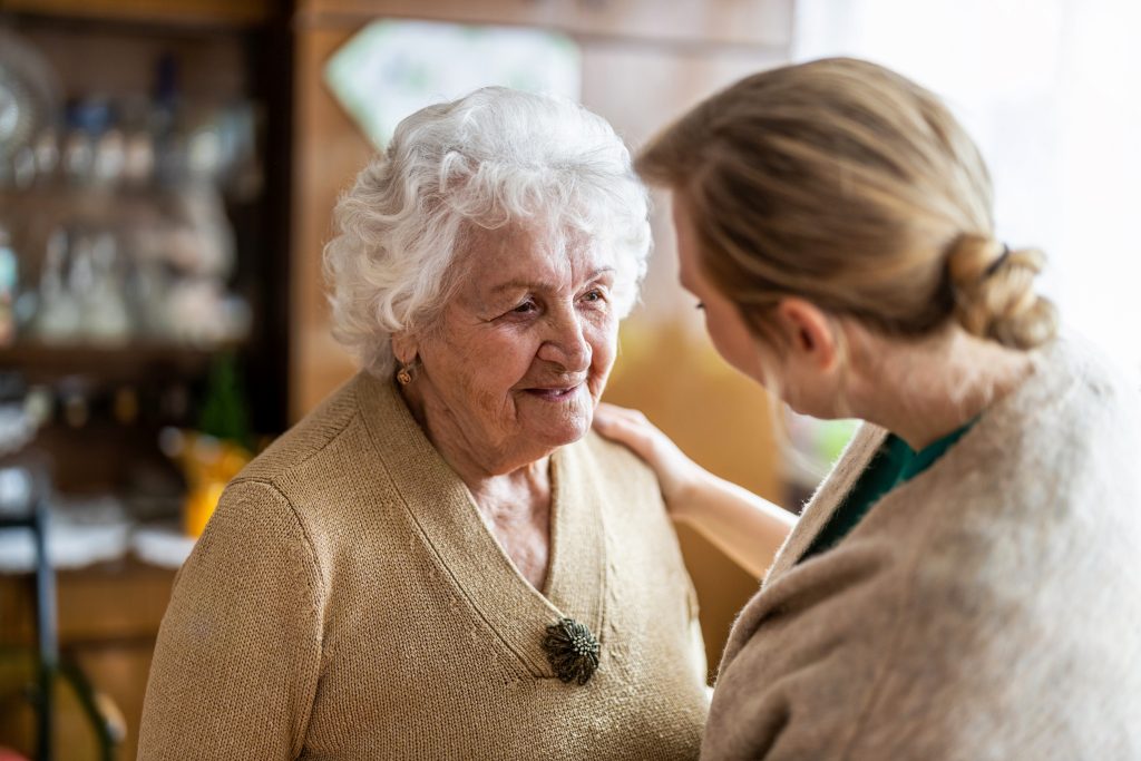 A support worker talking to her aged care client.