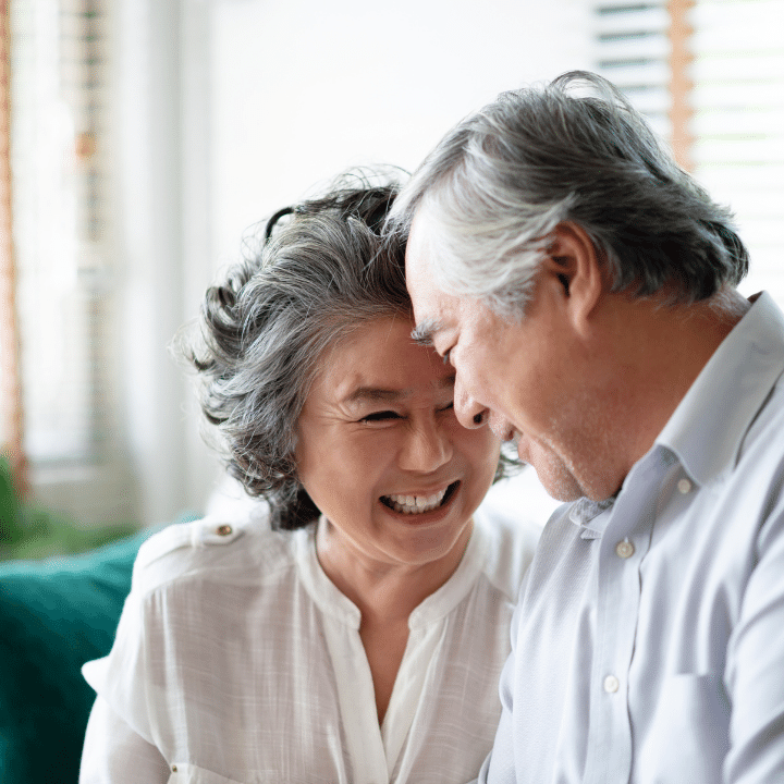 Senior Couple Laughing Together at Home