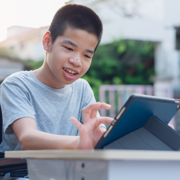 child interacting with ipad screen