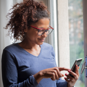 A woman uses her smartphone.