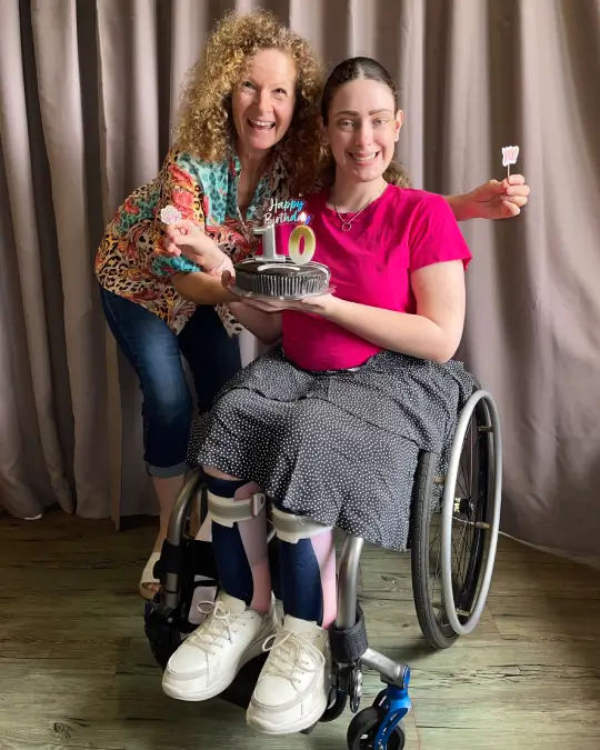 Ruth and Hayley with a birthday cake.