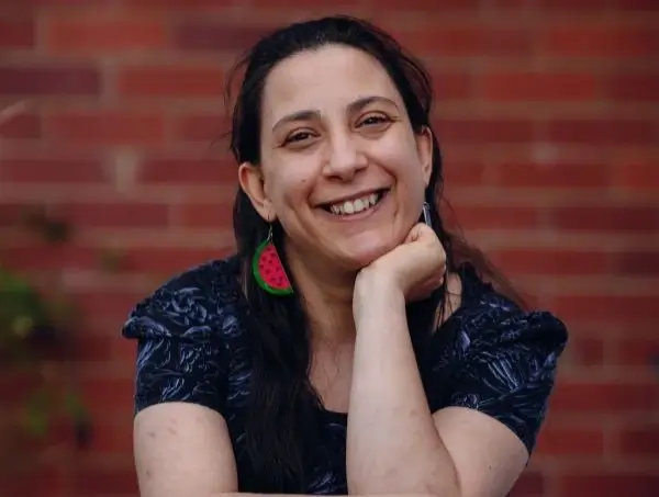 Writer Laura Pettenuzzo sitting and smiling