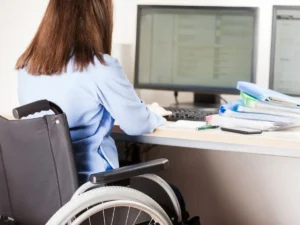 Woman using a wheelchair in a corporate office