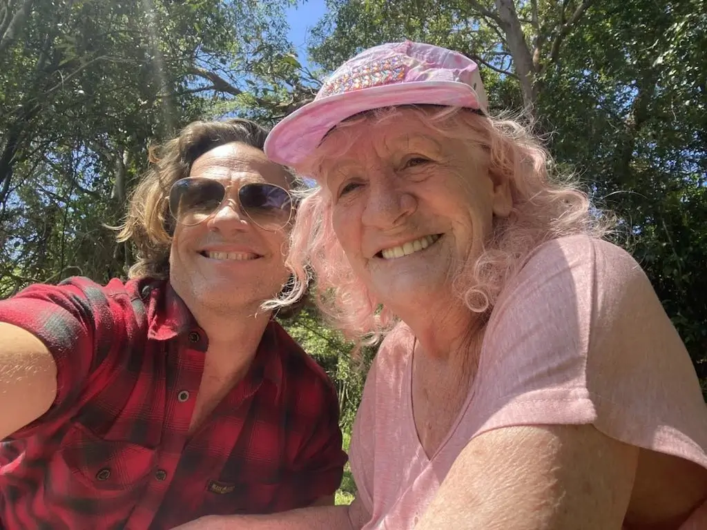 Support worker Martin smiling with his client Skye