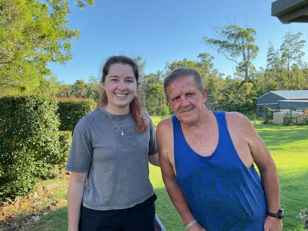Support worker Briony smiling with her client Toni