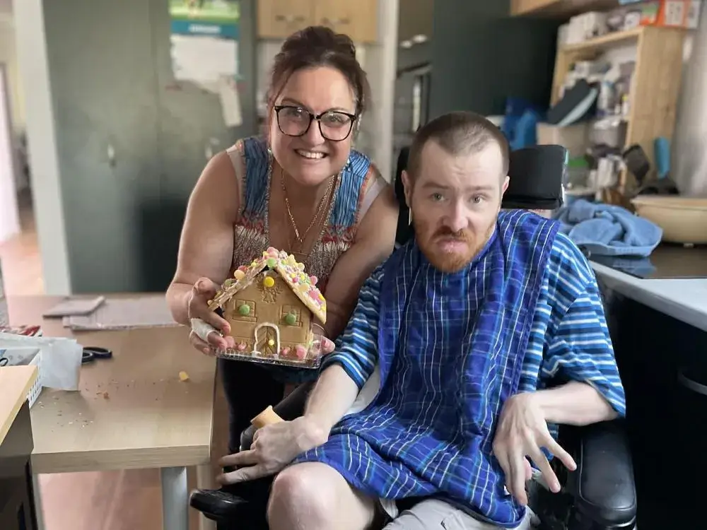 Support worker Pauline smiling with her client Joy
