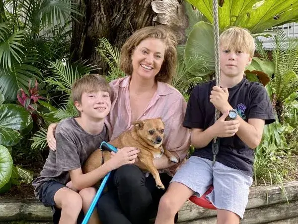 Mable client Lana smiles with her two sons