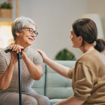 Older woman receiving support at home with support worker.