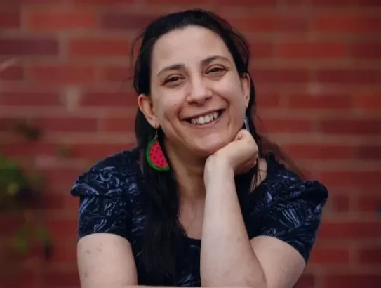 Writer Laura Pettenuzzo sitting and smiling