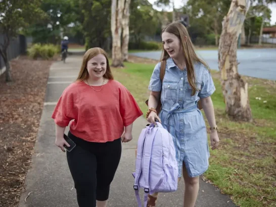 Mable client Alyssa walks with her independent support worker Natalie