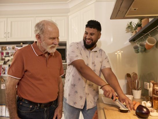 Independent support worker Pav helps Mable client Dave to prepare a meal in the kitchen.