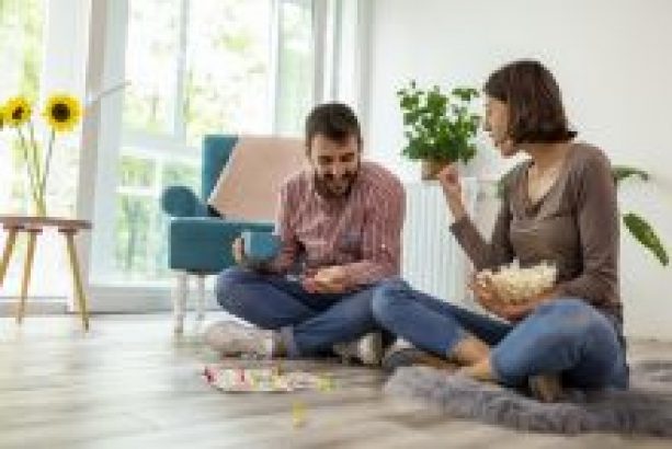 Participant and Support Worker playing board game at home