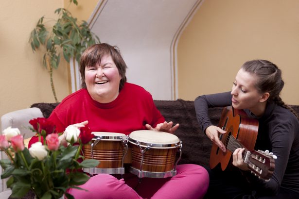 Two women make a music therapy and having fun