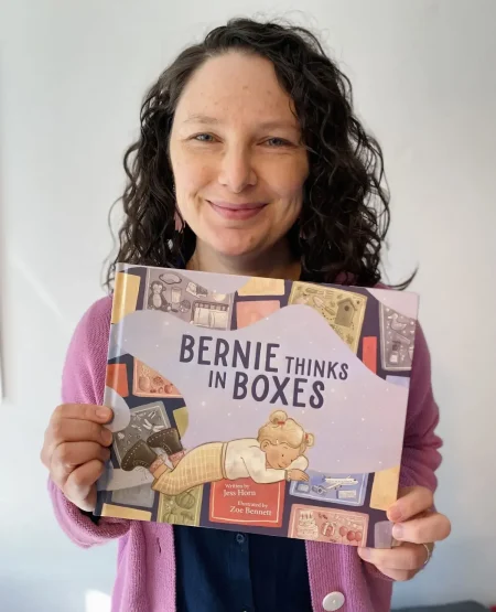 Author Jess Horn holds her book Bernie Thinks in Boxes