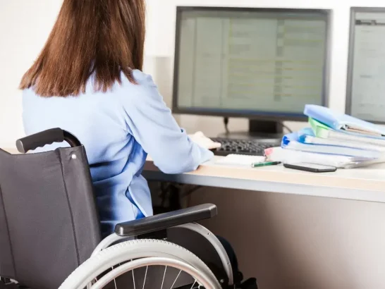 Woman using a wheelchair in a corporate office
