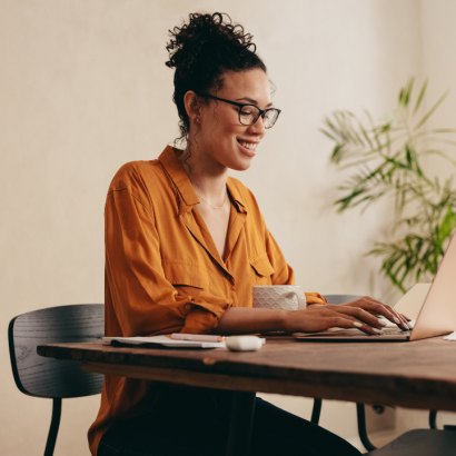 A woman working in a home office.